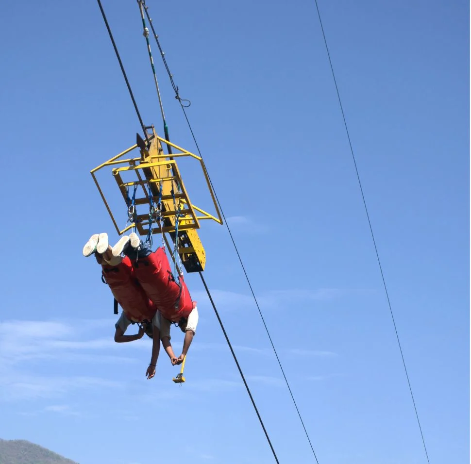 Flying Fox in Rishikesh 2026 with person ziplining over Ganga river at high speed, scenic valley views, best price booking by bucketlist